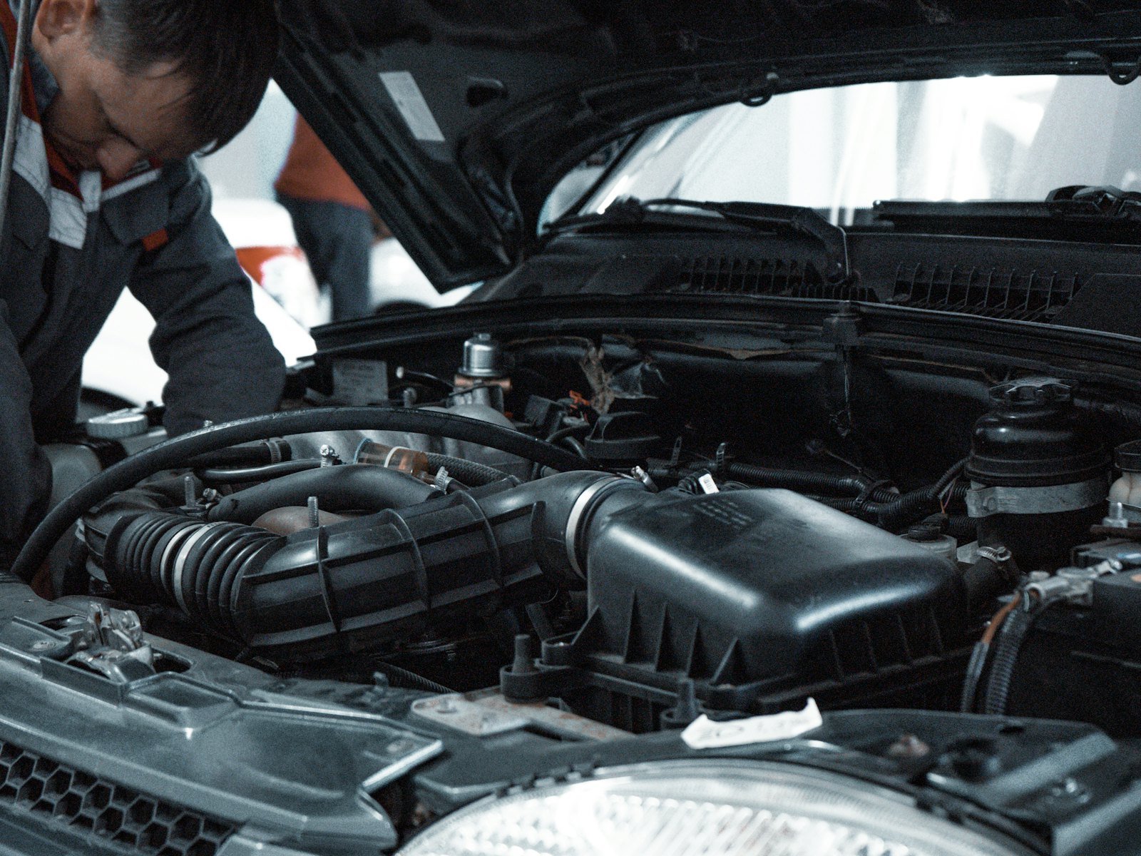 Mechanic inspecting a car engine
