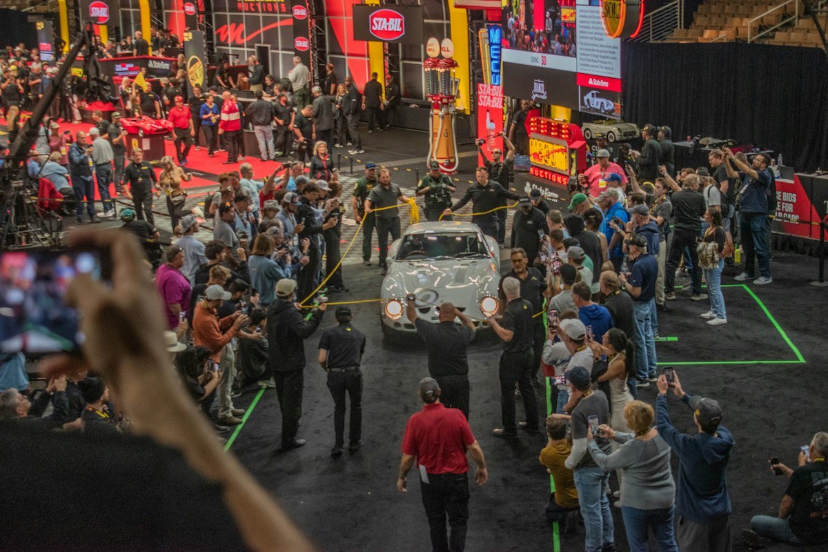 Buyers watching a car at an auction