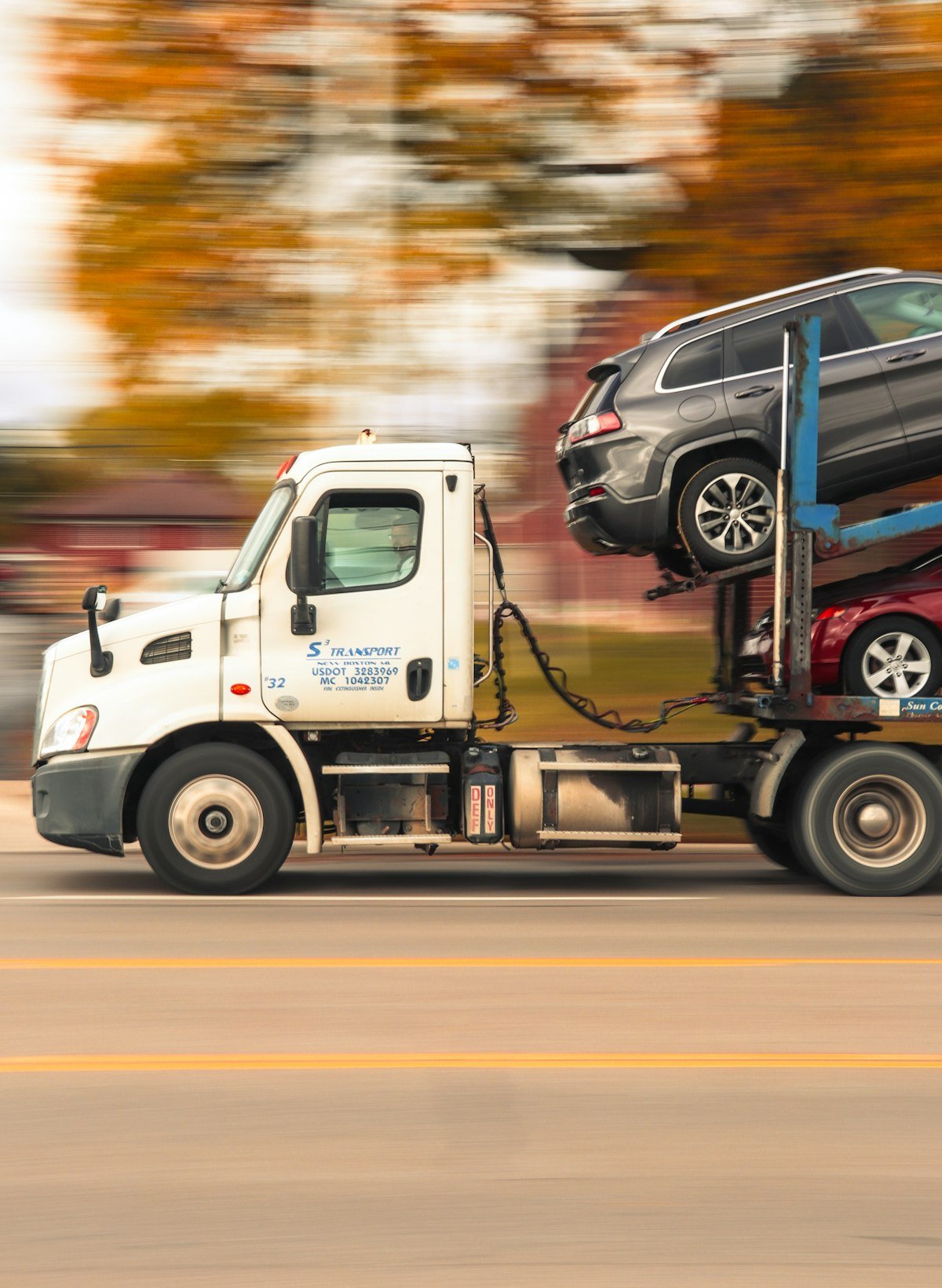 Car transporter truck delivering vehicles