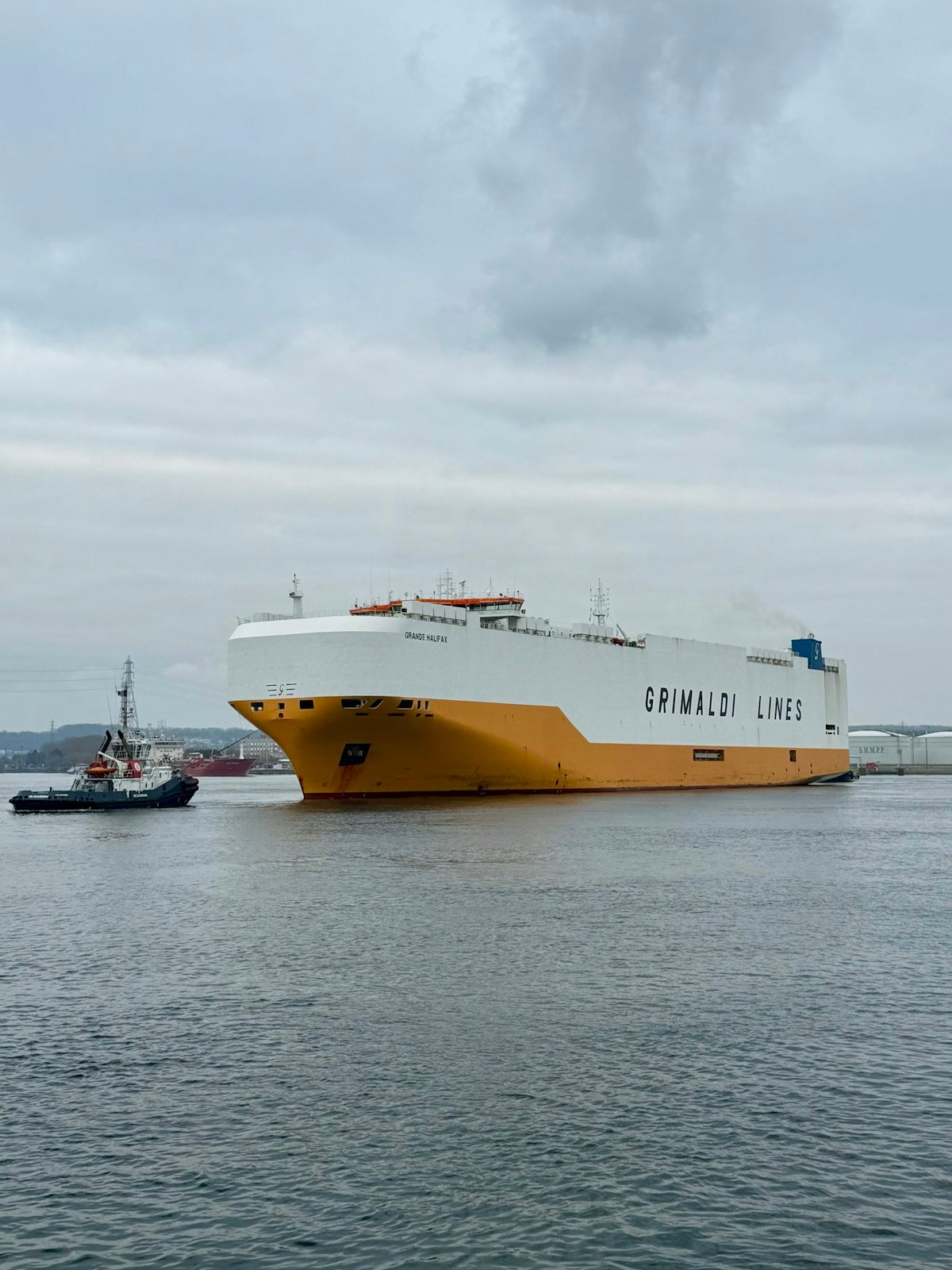 Car carrier ship heading out to sea